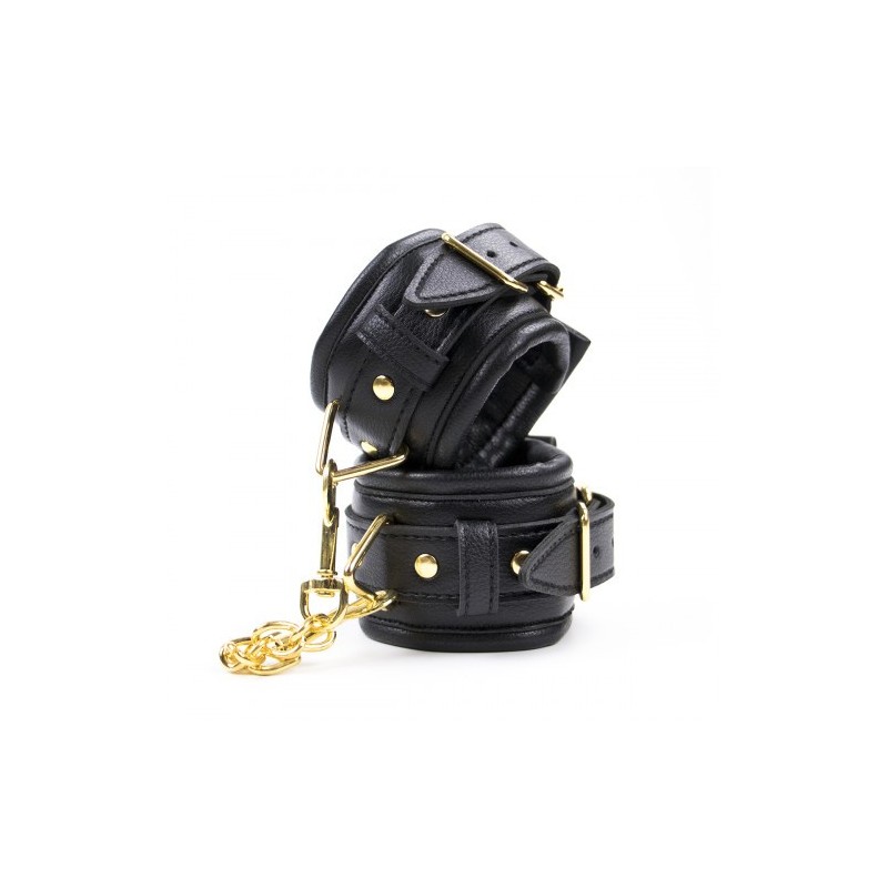 Μαύρες δερμάτινες ρυθμιζόμενες χειροπέδες με χρυσή αλυσίδα